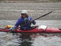 woman in sea kayak